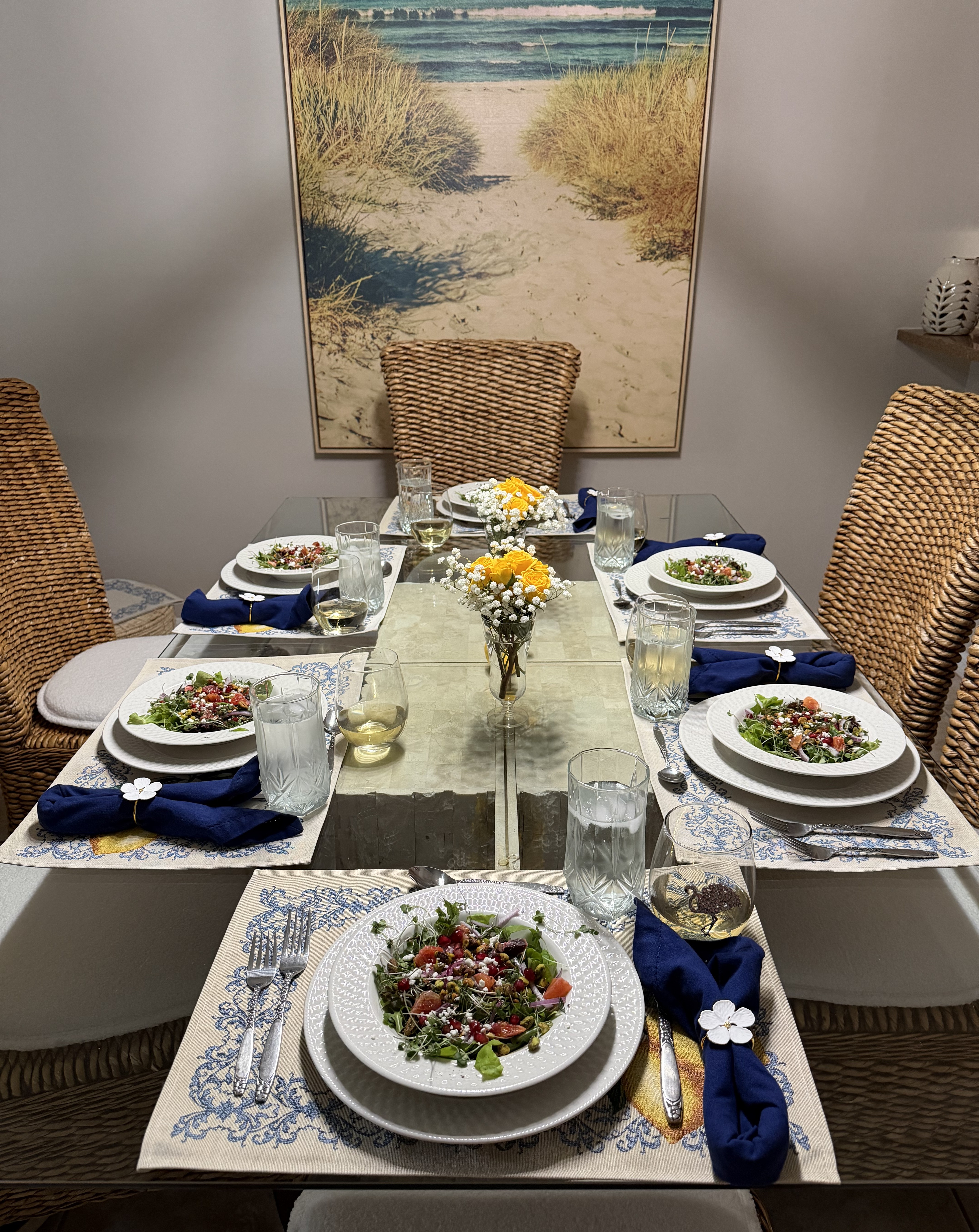 Table set with Blood Orange Pistachio Salad and wine for dinner party.