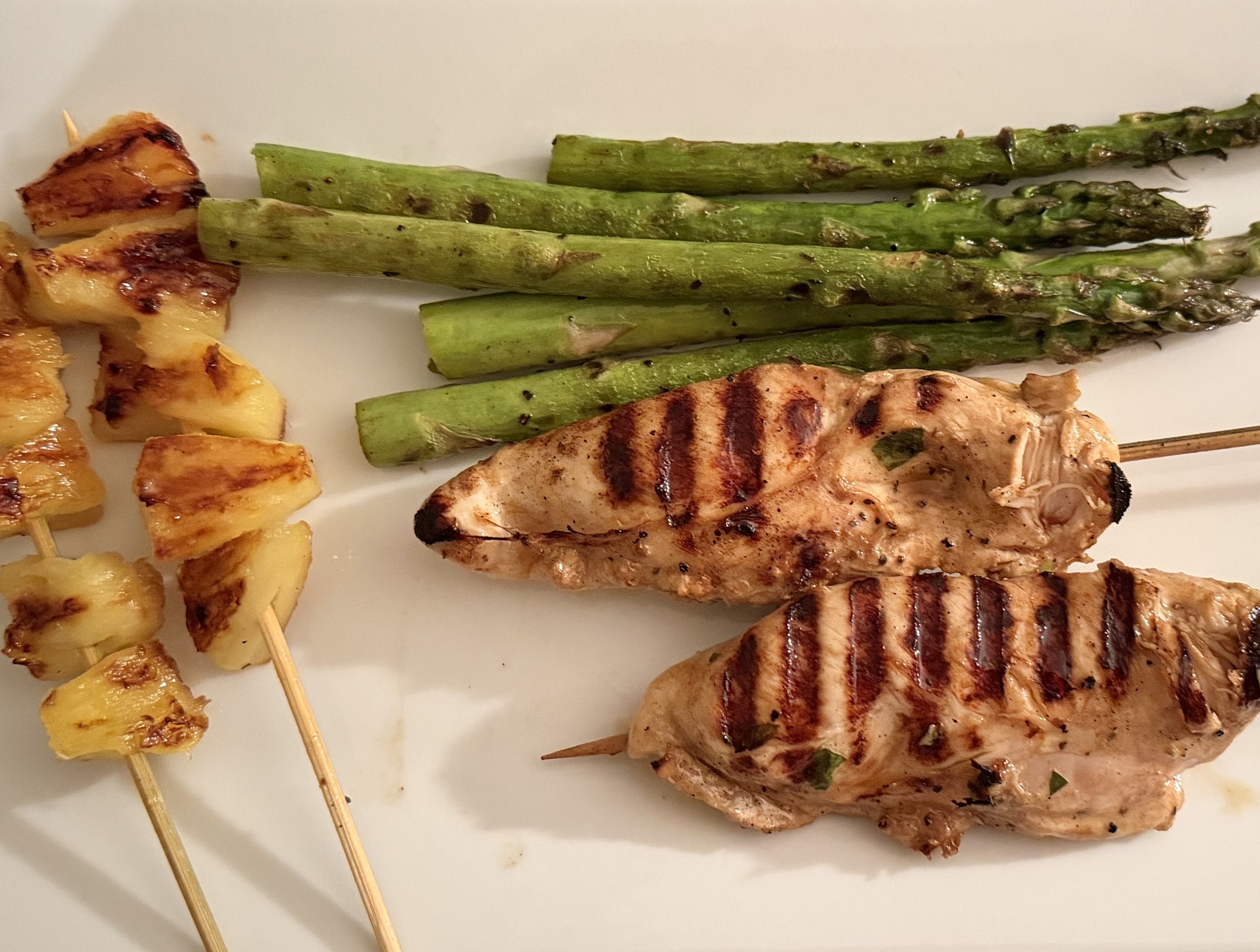 Grilled Chicken Tenders with Basil Served with Grilled Asparagus and Grilled Pineapple