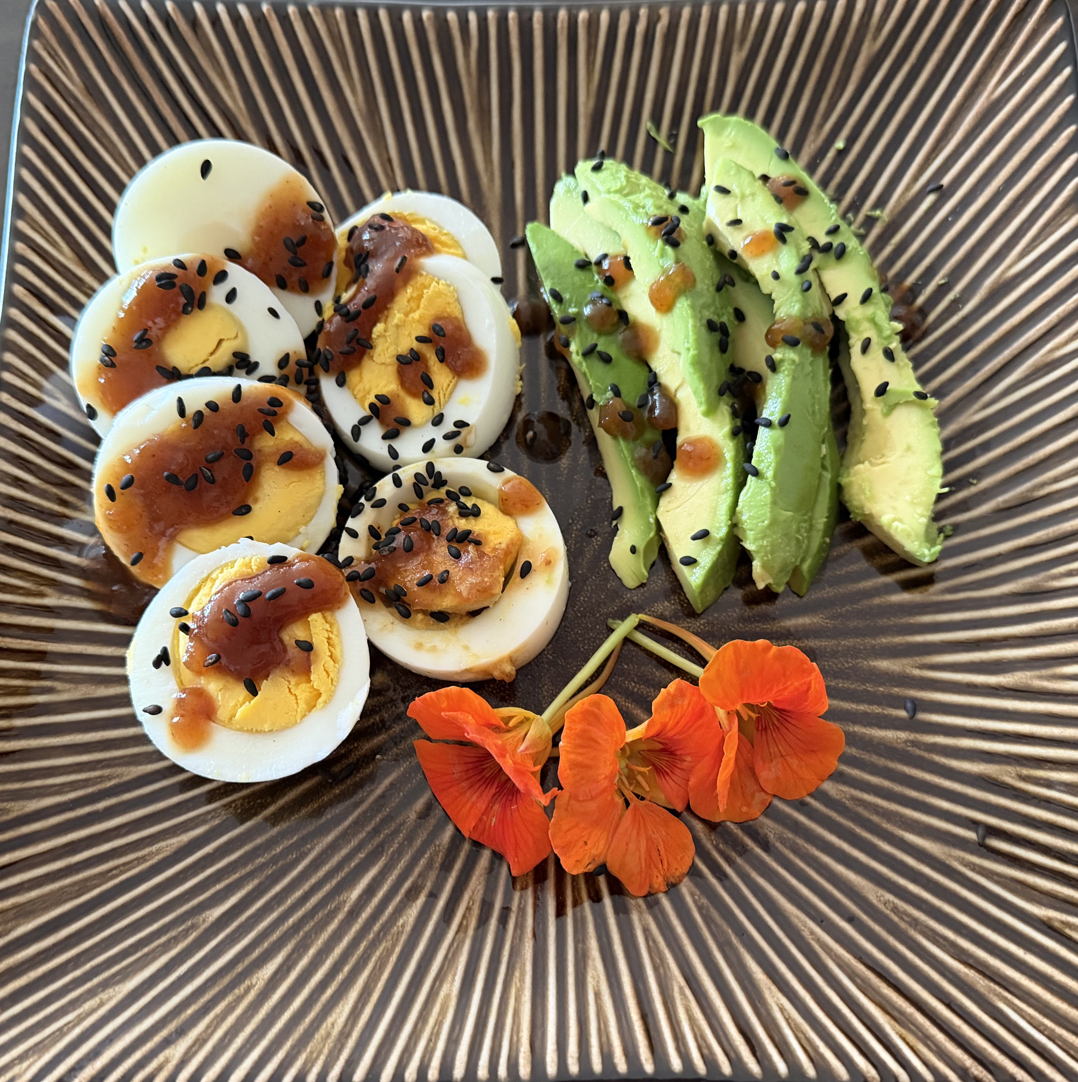 Boiled Eggs Served with Avocado and Nasturtium